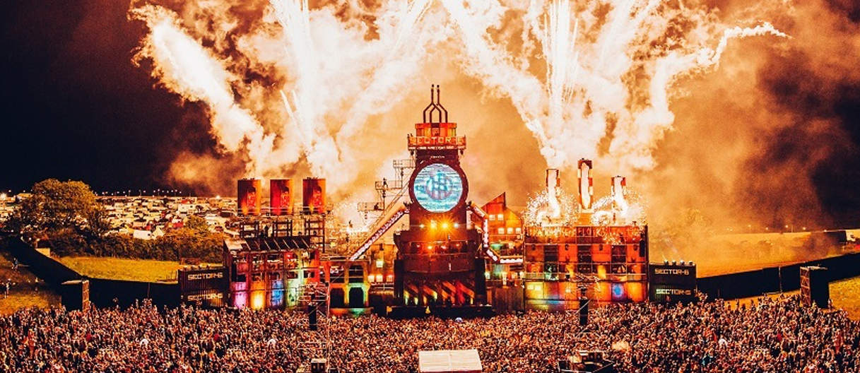 boomtown festival stage with fireworks